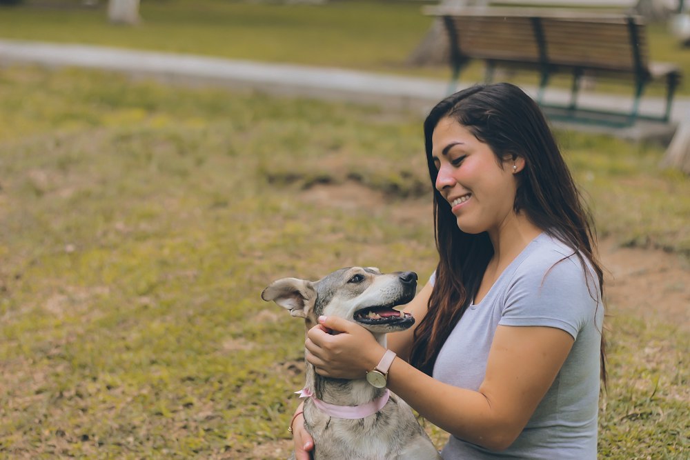 A woman connecting with her dog outdoors